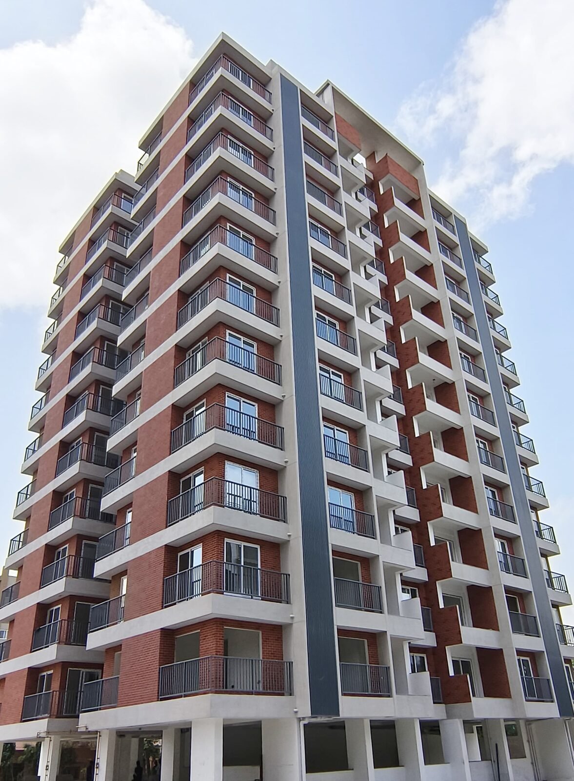 High-rise residential tower brick and expose concrete finish Ahmedabad