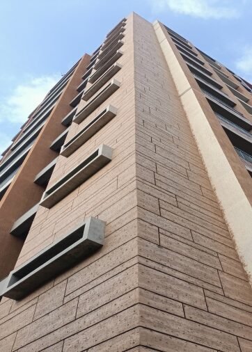 Wood look vertical stone cladding residential tower